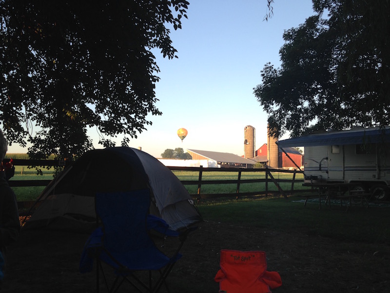 first camping trip with kids success hot air balloon over campsite mill bridge